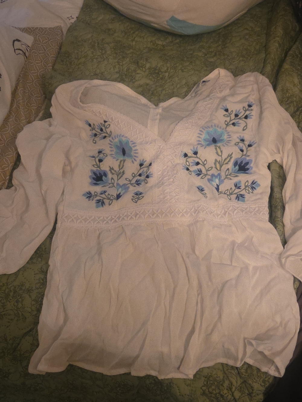 White Women's Embroidered V-Neck Peasant Top with Blue Floral Detail